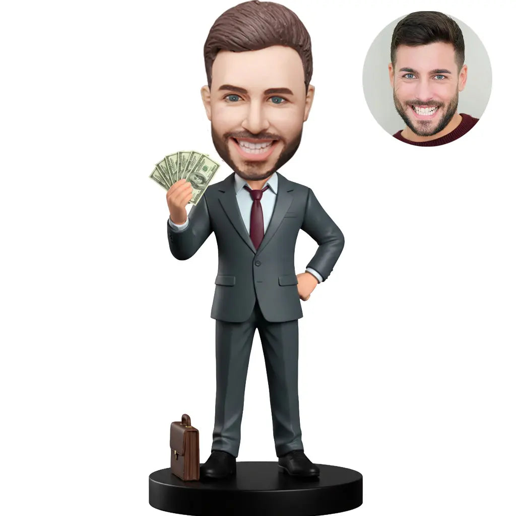 Custom bobblehead for men in dark gray suit holding cash fan with briefcase at feet – personalized millionaire boss gift handcrafted from photo