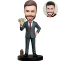 Custom bobblehead for men in dark gray suit holding cash fan with briefcase at feet – personalized millionaire boss gift handcrafted from photo