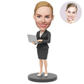 Custom Female Boss Bobblehead for Women in Dark Gray Skirt Suit Holding Laptop – Personalized Boss Day Gift for Her