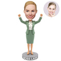 Custom Boss Lady Bobblehead for Women in Sage Green Skirt Suit Both Fists Raised – Personalized Boss Day Gift for Her