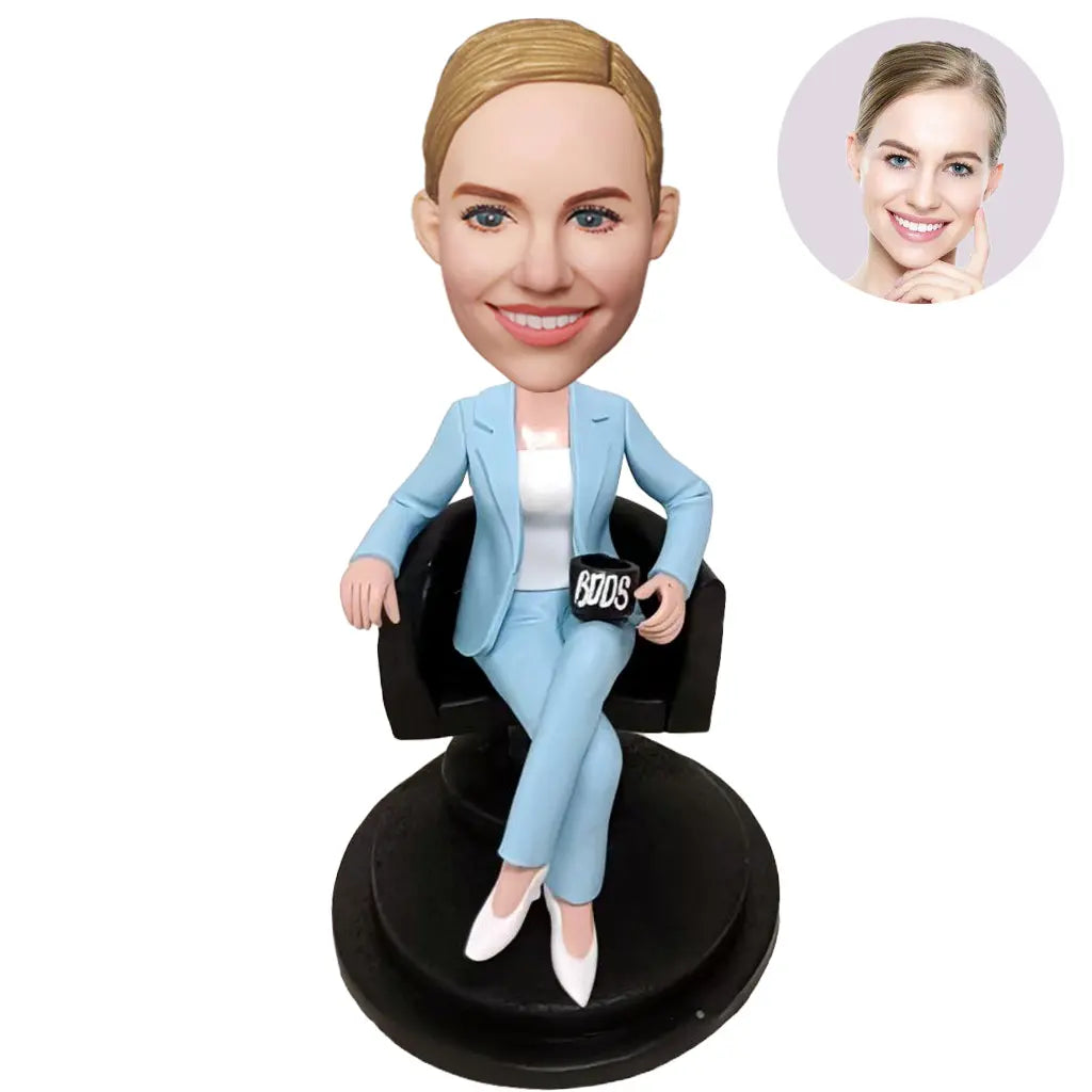 Custom Female Boss Bobblehead for Women in Sky Blue Suit Sitting in Armchair Holding Boss Mug – Personalized Boss Day Gift for Her