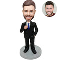 Custom bobblehead for men in black suit with blue tie adjusting tie – personalized boss gift handcrafted from photo