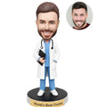 Custom male doctor bobblehead from photo in white coat and blue scrubs with stethoscope and medical chart