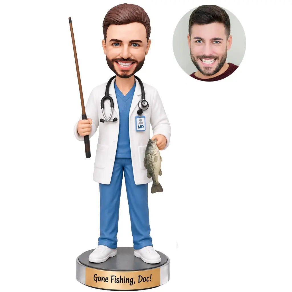 Custom doctor fishing bobblehead in medical scrubs and white coat holding a fishing rod and fish
