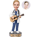 Custom female doctor bobblehead in white coat and medical scrubs playing an acoustic guitar