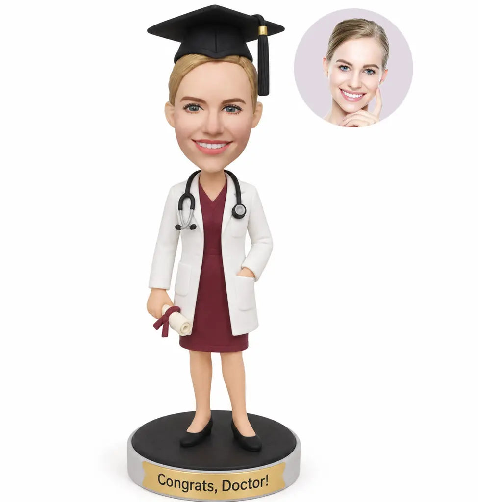 Custom female doctor graduation bobblehead from photo wearing a white coat and graduation cap while holding a diploma
