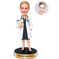Custom female pediatrician bobblehead in white coat with stethoscope and clipboard