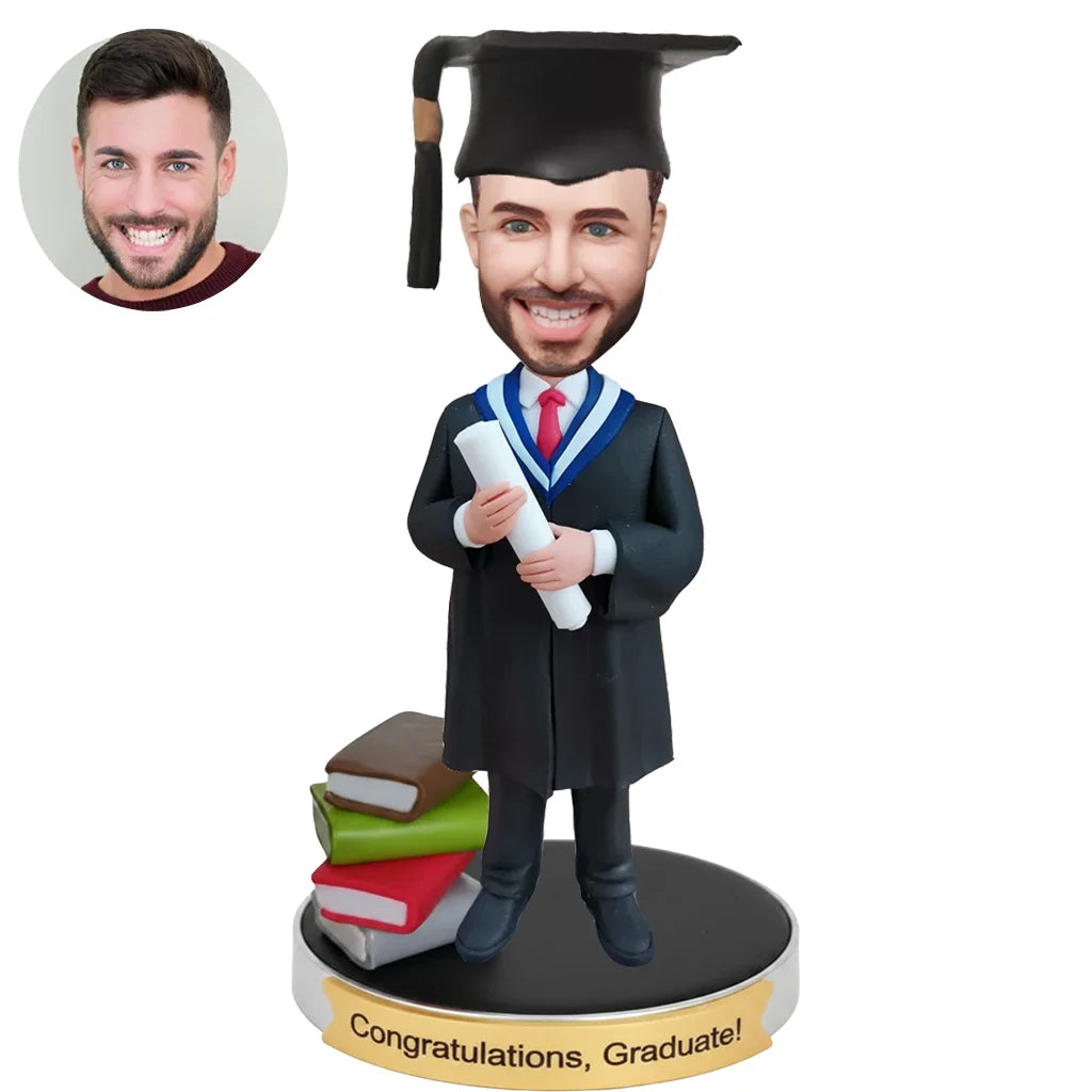 Custom graduation bobblehead from photo wearing cap and gown holding diploma