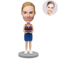 Custom bobblehead birthday gift for her – personalized woman in blue dress holding a birthday cake