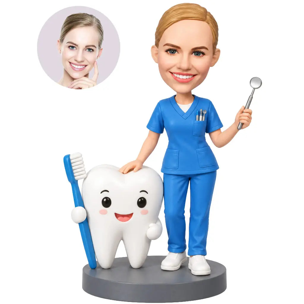 Custom female dentist bobblehead in blue scrubs standing beside a giant tooth and toothbrush