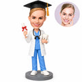 Custom female dentist graduation bobblehead with graduation cap, diploma and tooth model