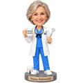 Custom female dentist retirement bobblehead holding a Retired Dentist mug and dental mirror