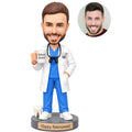 Custom male dentist retirement bobblehead holding a Retired Dentist mug with Happy Retirement base